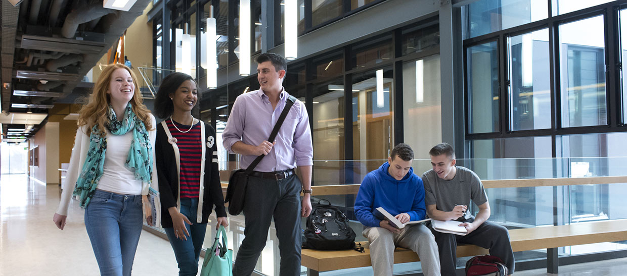 Students walking in a building on campus