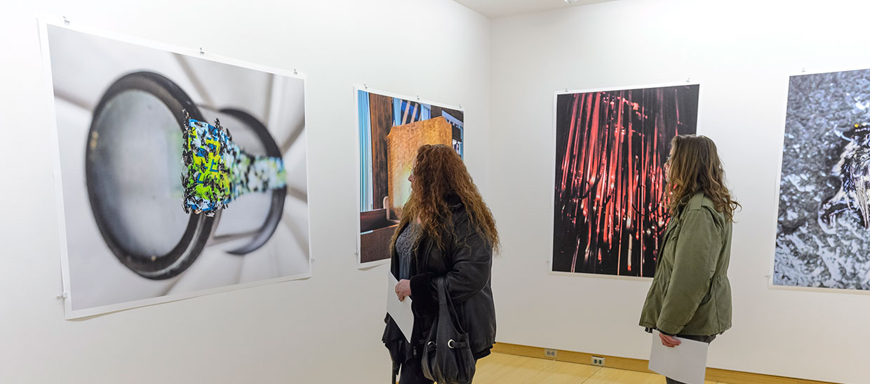 Students looking at artwork in the gallery