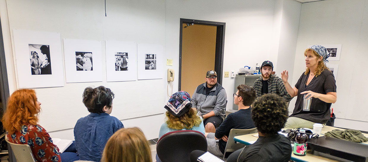 Gallery director Tara Fracalossi in classroom with students