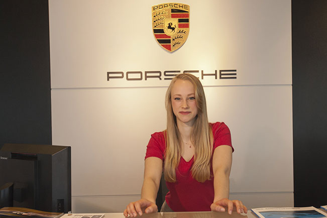 Siri W. at a car dealership