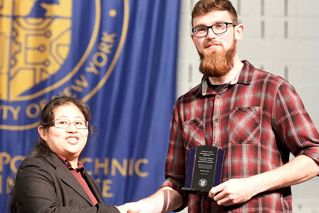 Dalton receiving the Outstanding MET student award