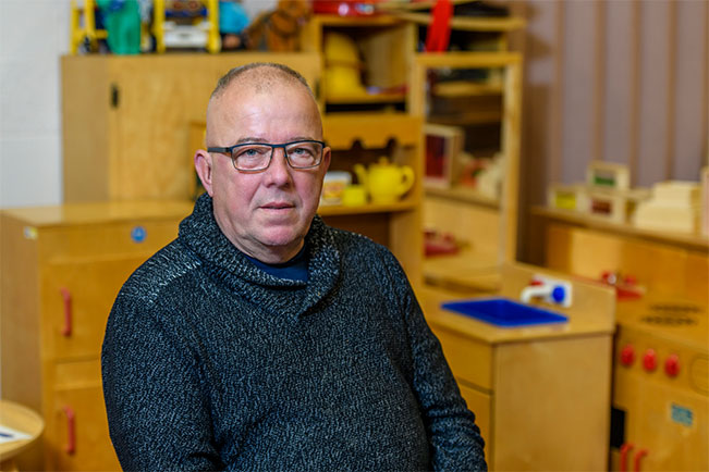Stephen Breen poses in the Early Childhood Education classroom