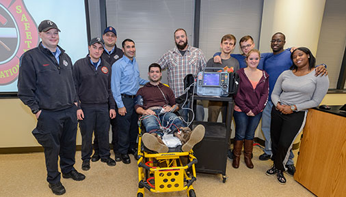 Paramedic students with the donated equipment