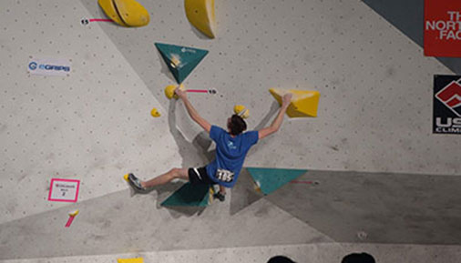Ray Hansen climbing a rock wall