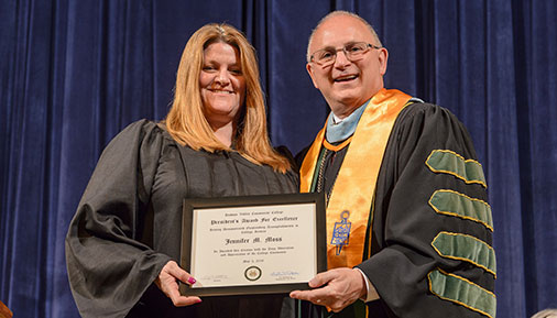 Jennifer Moss receiving her award from President Matonak