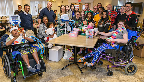 Group photo of respiratory care students with residents at Pathways Rehab