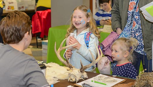 Child learning about a camp