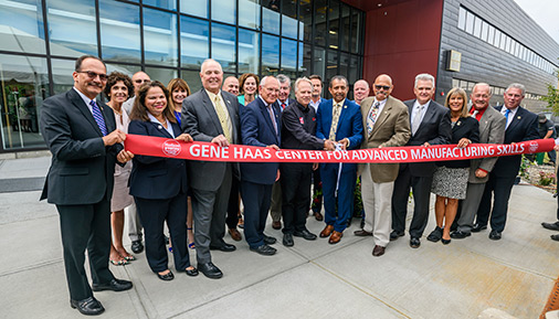 College and state officials pose with donors at ribbon cutting ceremony