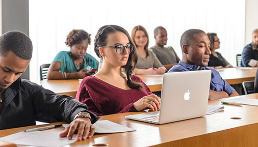 Students in classroom working and listening