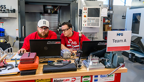 Two students working on the Next Generation Manufacturing Challenge Series Team Challenge
