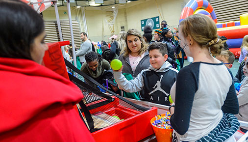 A child plays a carnival gave at the 2018 Pumpkin Palooza Family Fall Festival
