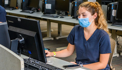 Health science student working on computer