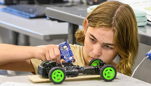 Students builds a car during camp
