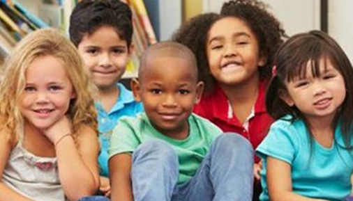Young children pose for a photo together