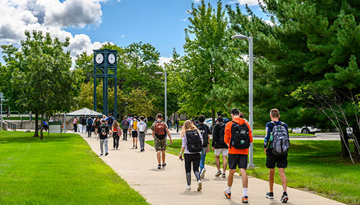 Students walking in front of clocktower