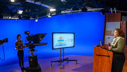 Speaker in studio recording livestream