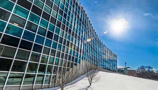 Exterior of Administration Building with snow on the ground