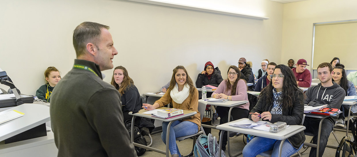 Professor talking to class full of students
