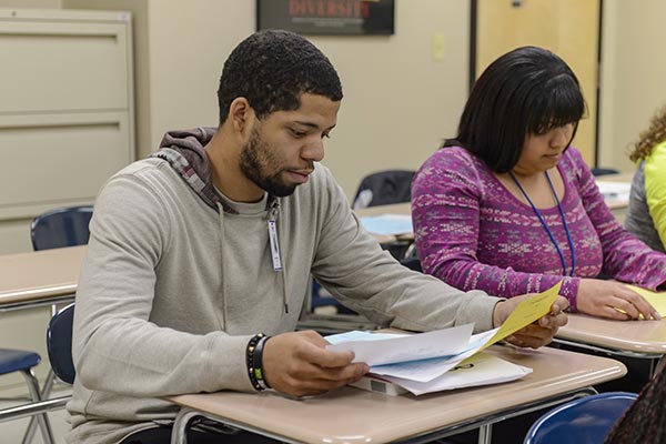 Student and professor working on a computer